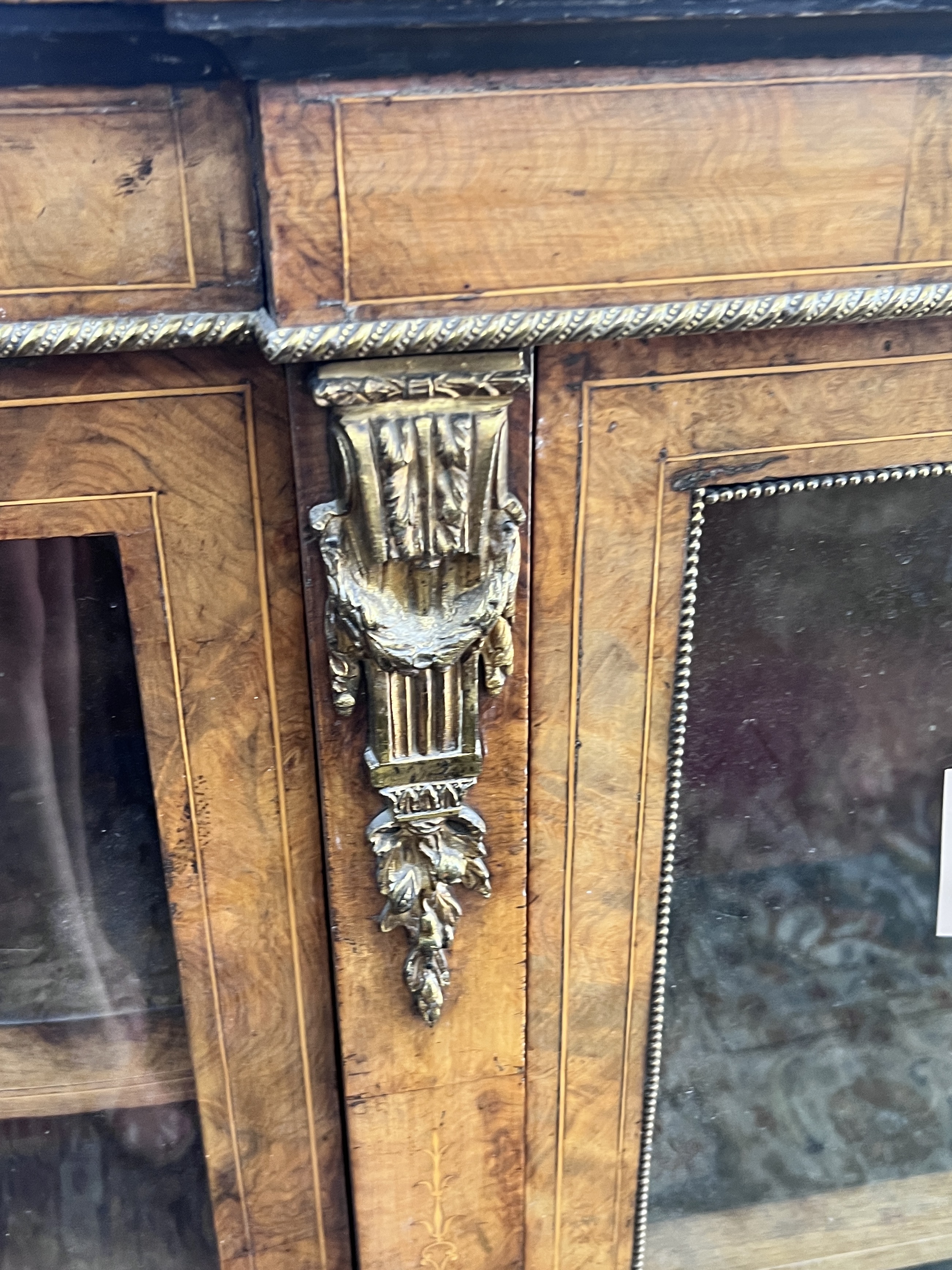 A Victorian walnut gilt metal mounted credenza, width 156cm, depth 35cm, height 102cm